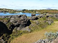Höfði, on the eastern shore of Mývatn, is a headland with grass, so goats, and many klasar (lava pillers).