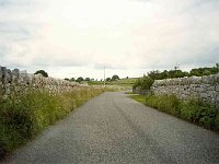 Typical Irish road, with rock wall or hedge so close to the road there is no way to get off it  The Burren