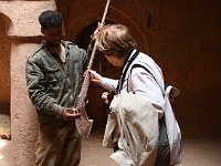 Ksar of Tamnougalt  Siv and the guide admire an old "rifle", used only for spectacles