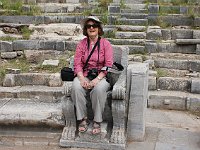 Priene  Nicely carved front-row seats, demonstrated by a 21st-century European theater-goer