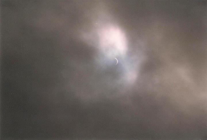 br99_eclipse_3.jpg - We were exceptionally lucky to see it through a hole in the clouds.