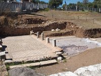 Near the steps, an excavated mosaic floor and some broken columns.  gr17 091613231 s