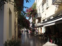 Quiet street with oleanders and a pleasant cafe.  gr17 091210400 s