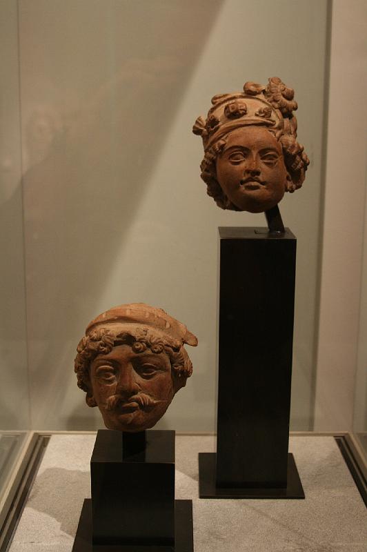 mg07_100112442_j_r.jpg - Heads of man and woman, Jammu and Kashmir, 6th century, red terra cotta