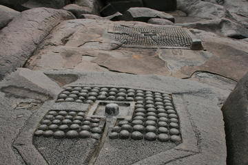 Lingas carved in boulder