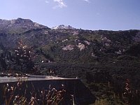 The walk starts by crossing the long dam, then zigzags up the slope through a labyrinth in high bushes or low trees.  sj93 49b059 b