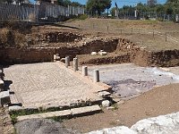 Near the steps, an excavated mosaic floor and some broken columns.  gr17 091613231 s