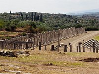 Along the eastern side alone, there are 76 columns standing. There must be about 200 in all. (Count them if you don't believe me.) There are fascinating pictures of the excavation and restauration on the  Ancient Messene  site.  gr17 092010420 k ab c