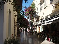 Quiet street with oleanders and a pleasant cafe.  gr17 091210400 s