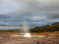 The geyser Strokkur starting to erupt
