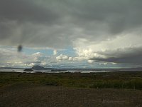 Mývatn, or Midge Lake, deserves its name. The dark spot is a midge right in front of the lens, one of many. The mountain in the lake is Vindelbelgjarfjall.
