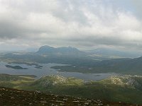 View from the top (well, almost) of Stac Pollaidh, with Suilven and Cul Mor (capped in clouds)  Scottish HIghlands, August 2004