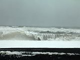 Crashing waves on black, gravel beach at Reynisfjall
