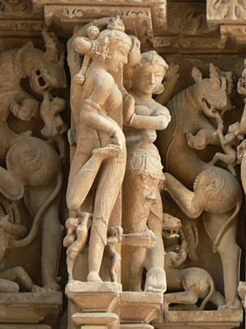 Apsara putting henna on her feet
