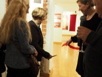 sj18 012014130 aa-cr-1000  Siv cuts the ribbon; Alice Stridh's daughter and one of Ea, Agneta & Britt, who work as voliunteers at the museum.